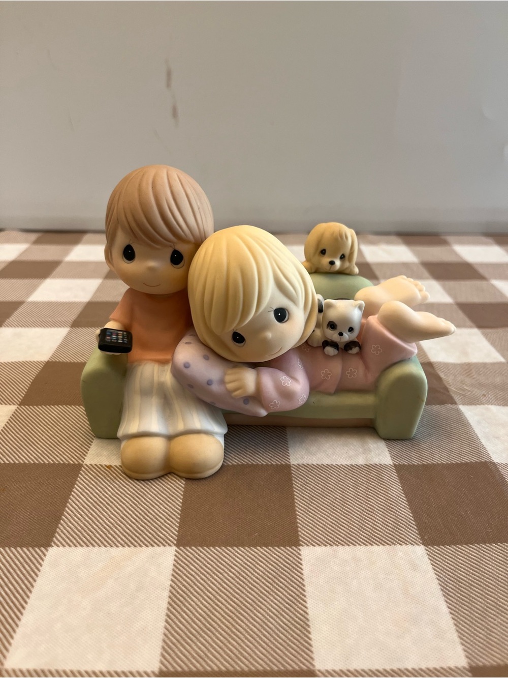 Precious Moments Figurine couple on Green Sofa - Pastel Beige and Pink